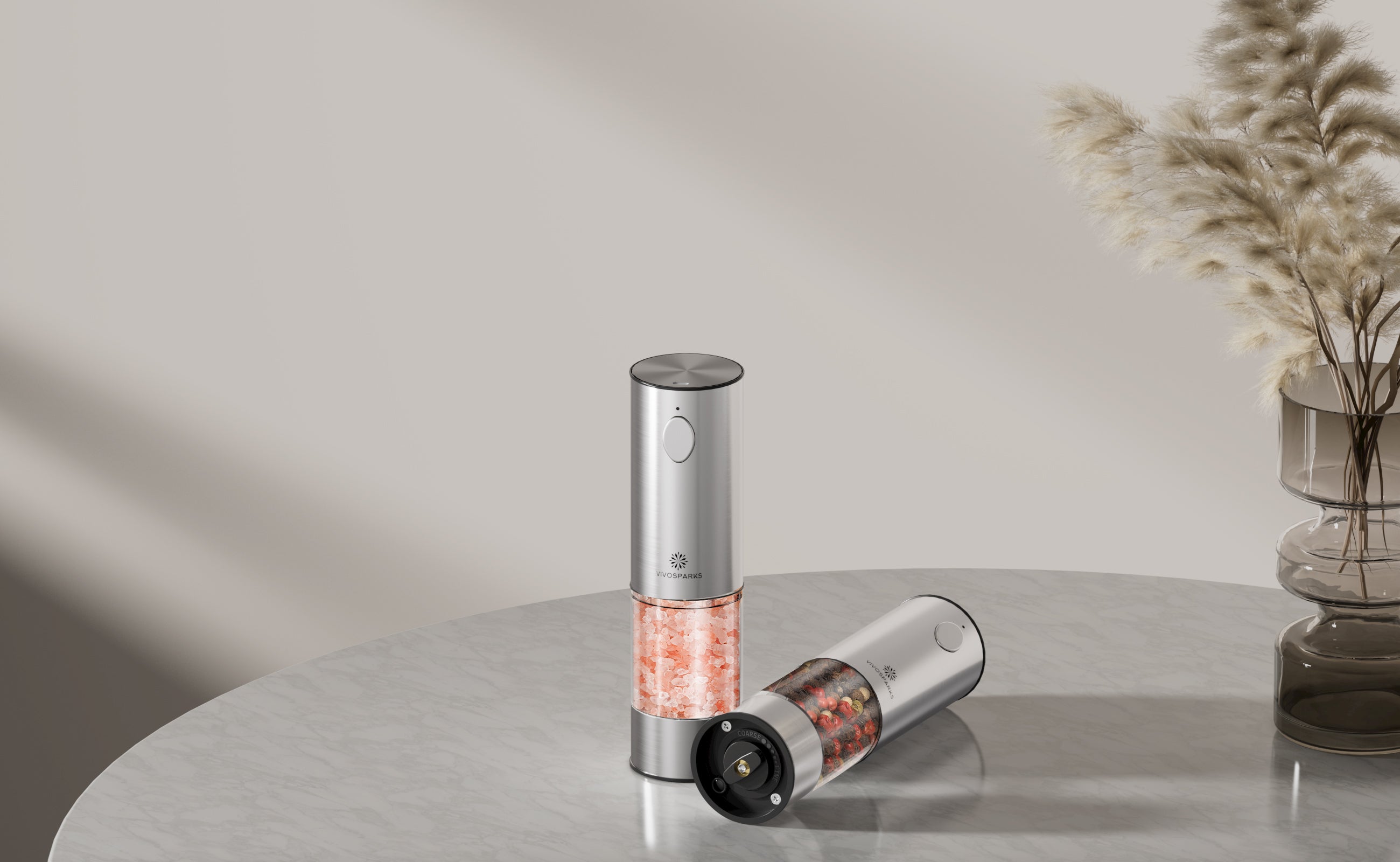 Two wine openers on a reflective surface with a neutral background