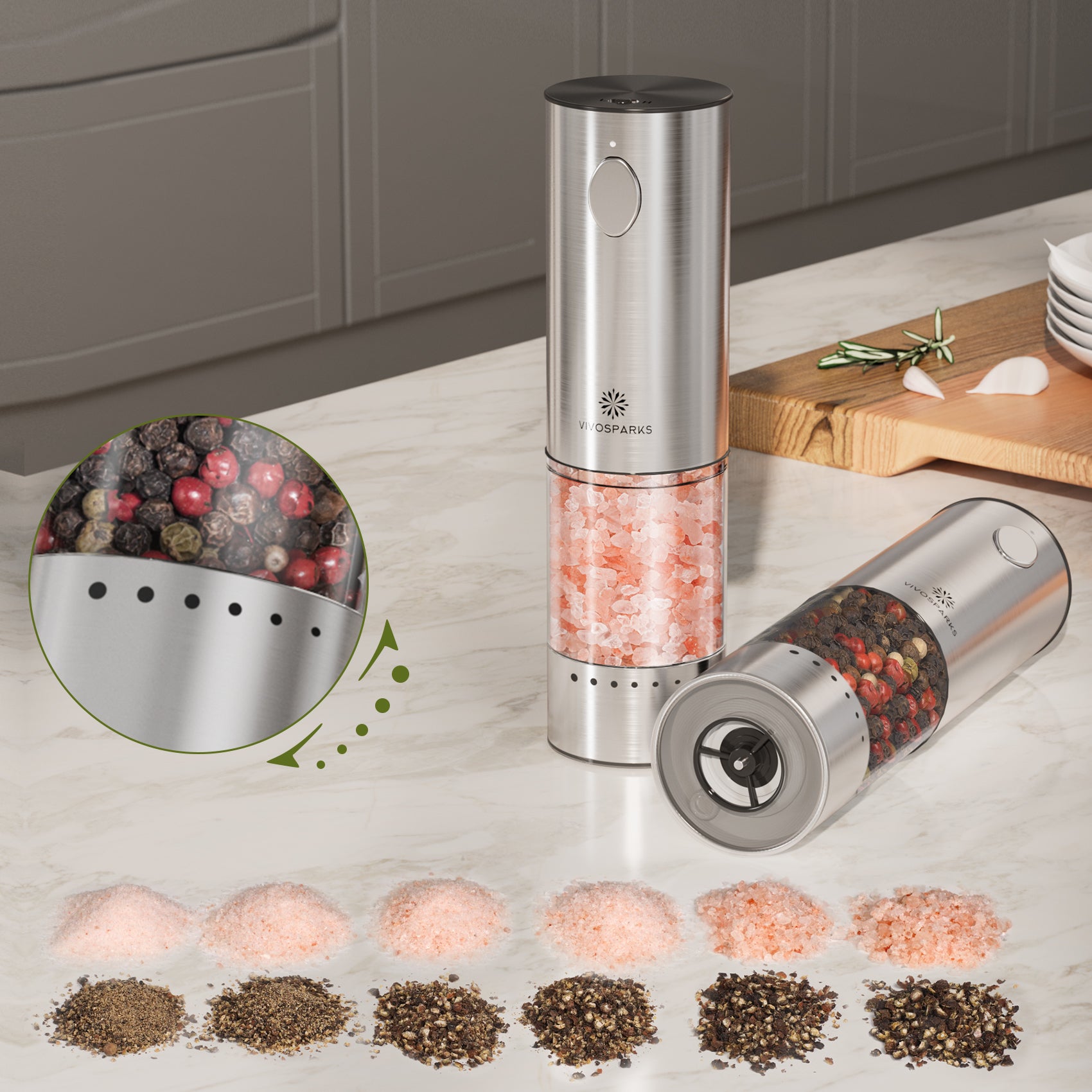 Two electric pepper mills on a kitchen counter with a close-up of peppercorns and a display of different types of salt.